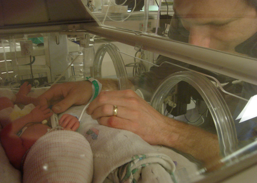 Scott gets to work taking temperatures and changing diapers
